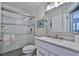 Clean bathroom with white vanity and glass shower at 801 E 8Th Ave, New Smyrna Beach, FL 32169