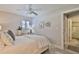 Comfortable bedroom with ceiling fan and ensuite bathroom access at 801 E 8Th Ave, New Smyrna Beach, FL 32169