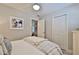 Bright bedroom with a comfortable bed and ample closet space at 801 E 8Th Ave, New Smyrna Beach, FL 32169