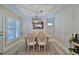 Bright dining room with farmhouse table and chandelier at 801 E 8Th Ave, New Smyrna Beach, FL 32169