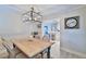 Charming dining room featuring a rustic wooden table and chandelier at 801 E 8Th Ave, New Smyrna Beach, FL 32169
