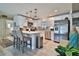 Modern white kitchen with stainless steel appliances and an island at 801 E 8Th Ave, New Smyrna Beach, FL 32169
