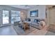 Comfortable living room with light gray sofa and wood coffee table at 801 E 8Th Ave, New Smyrna Beach, FL 32169