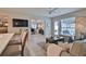Bright living room features an open floor plan, hardwood floors, and a cozy sitting area at 801 E 8Th Ave, New Smyrna Beach, FL 32169