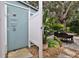 Outdoor shower with privacy enclosure and adjacent patio at 801 E 8Th Ave, New Smyrna Beach, FL 32169