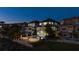 Luxury home at night with pool and outdoor fire pit at 8010 Firenze Blvd, Orlando, FL 32836