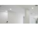 Open basement area with high ceilings and recessed lighting at 8010 Firenze Blvd, Orlando, FL 32836