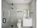 Clean bathroom with glass shower, floating vanity, and modern fixtures at 8010 Firenze Blvd, Orlando, FL 32836