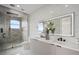 Bathroom with modern double vanity and walk-in shower at 8010 Firenze Blvd, Orlando, FL 32836
