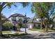 Luxury home with driveway and landscaped yard at 8010 Firenze Blvd, Orlando, FL 32836