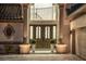 Elegant entryway with double doors and ornate detailing at 8010 Firenze Blvd, Orlando, FL 32836