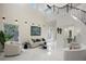Bright and airy living room with high ceilings and marble floors at 8010 Firenze Blvd, Orlando, FL 32836