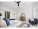 Main bedroom with sliding barn door to en-suite bathroom and lake view at 8010 Firenze Blvd, Orlando, FL 32836