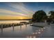 Spacious patio with fire pit and lake view at 8010 Firenze Blvd, Orlando, FL 32836