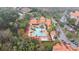 Community pool, lush landscaping, and ample parking at 8010 Tuscany Way # 5302, Davenport, FL 33896