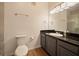 Bathroom features dark vanity, granite countertop, and shower at 8010 Tuscany Way # 5302, Davenport, FL 33896