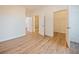 Bright bedroom with hardwood floors and access to bathroom and closet at 8010 Tuscany Way # 5302, Davenport, FL 33896