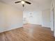Open dining room with hardwood floors and modern light fixture at 8010 Tuscany Way # 5302, Davenport, FL 33896