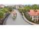 Gated community entrance with guardhouse and lush landscaping at 8010 Tuscany Way # 5302, Davenport, FL 33896
