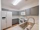 Modern kitchen with gray cabinets, marble countertops, and stainless steel sink at 8010 Tuscany Way # 5302, Davenport, FL 33896