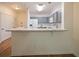 Modern kitchen with gray cabinets, marble countertops, and breakfast bar at 8010 Tuscany Way # 5302, Davenport, FL 33896