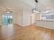 Spacious living room with hardwood floors and sliding glass doors at 8010 Tuscany Way # 5302, Davenport, FL 33896