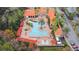 Resort-style pool with lounge chairs and umbrellas at 8010 Tuscany Way # 5302, Davenport, FL 33896
