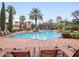 Inviting pool area with ample lounge chairs at 8010 Tuscany Way # 5302, Davenport, FL 33896