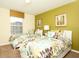 Two twin beds in a bright bedroom with floral bedding at 8938 Majesty Palm Rd, Kissimmee, FL 34747