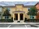Two-story townhome with attractive landscaping and two-car parking at 8938 Majesty Palm Rd, Kissimmee, FL 34747
