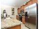 Modern kitchen with stainless steel appliances and granite countertops at 8938 Majesty Palm Rd, Kissimmee, FL 34747