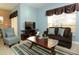 Cozy living room featuring a brown sofa and striped rug at 8938 Majesty Palm Rd, Kissimmee, FL 34747