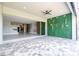 Covered patio with artificial green wall at 13370 Alderley Dr, Orlando, FL 32832