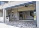 Covered patio with retractable screens and view into home at 13370 Alderley Dr, Orlando, FL 32832