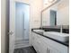 Elegant bathroom with dual sinks and dark countertop at 13370 Alderley Dr, Orlando, FL 32832