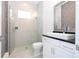 Modern bathroom with a glass shower and white vanity at 13370 Alderley Dr, Orlando, FL 32832