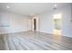 Large bedroom with wood-look floors and ensuite bathroom access at 13370 Alderley Dr, Orlando, FL 32832