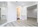 Bedroom with wood-look floors and access to bathroom at 13370 Alderley Dr, Orlando, FL 32832