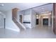 Elegant entryway with double doors and a large mirror at 13370 Alderley Dr, Orlando, FL 32832