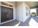 Front entrance with double doors and a brick walkway at 13370 Alderley Dr, Orlando, FL 32832