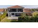 House back view with large patio and screened balcony at 13370 Alderley Dr, Orlando, FL 32832