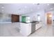 Open concept kitchen with island and stainless steel appliances at 13370 Alderley Dr, Orlando, FL 32832