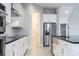 Modern kitchen with stainless steel appliances and white cabinetry at 13370 Alderley Dr, Orlando, FL 32832