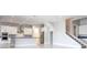 Modern kitchen with white cabinets, stainless steel appliances, and large island at 13370 Alderley Dr, Orlando, FL 32832