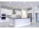 Modern kitchen with white cabinets, stainless steel appliances and breakfast bar at 13370 Alderley Dr, Orlando, FL 32832