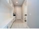 Laundry room with washer, dryer, cabinets, and a sink at 13370 Alderley Dr, Orlando, FL 32832