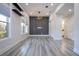 Open living area with hardwood floors and built-in shelving at 13370 Alderley Dr, Orlando, FL 32832