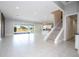 Bright and spacious living room with tile floors and sliding glass doors leading to patio at 13370 Alderley Dr, Orlando, FL 32832