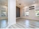 Bright living room with hardwood floors and an accent wall at 13370 Alderley Dr, Orlando, FL 32832