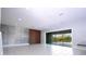 Spacious living area with large windows and wood accent wall at 13370 Alderley Dr, Orlando, FL 32832